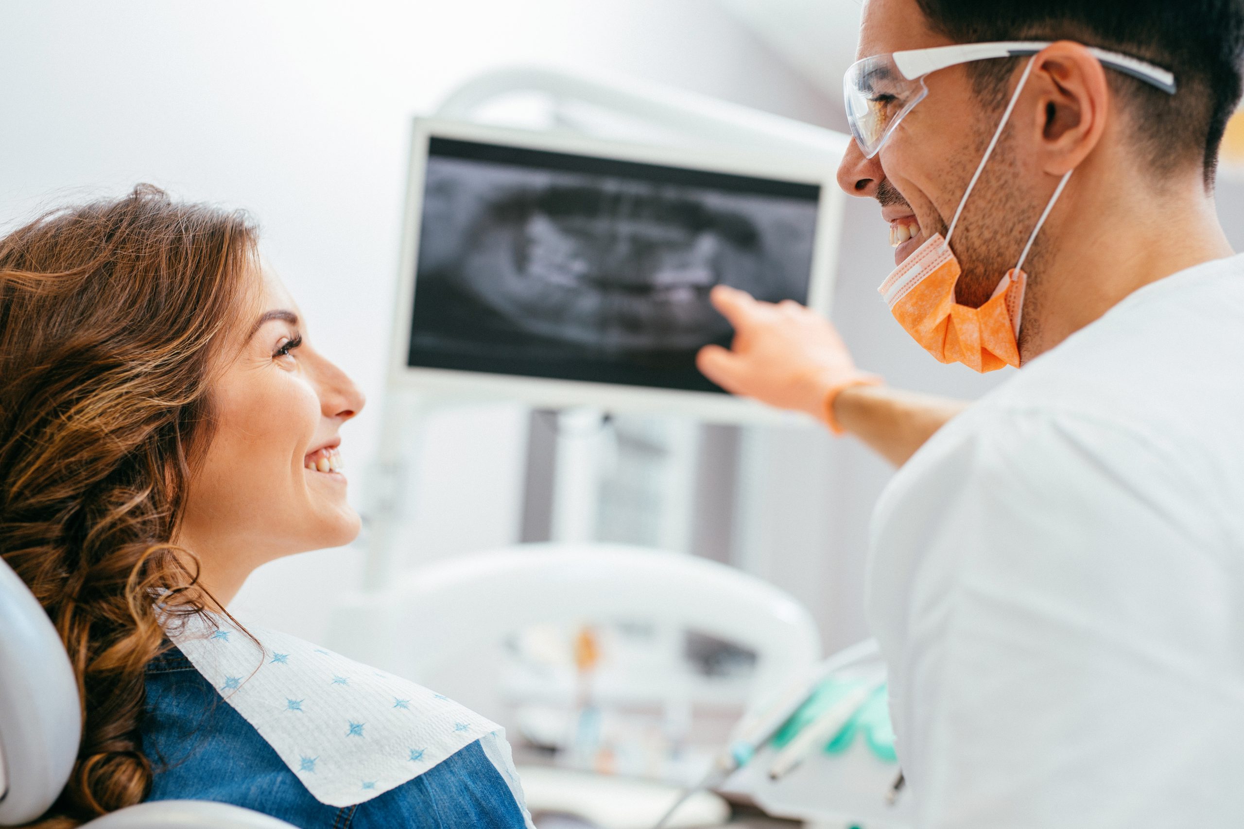 Dentist showing a patient her x-ray